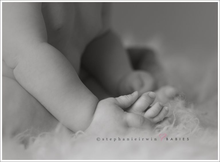 Macro shot of baby feet and hands