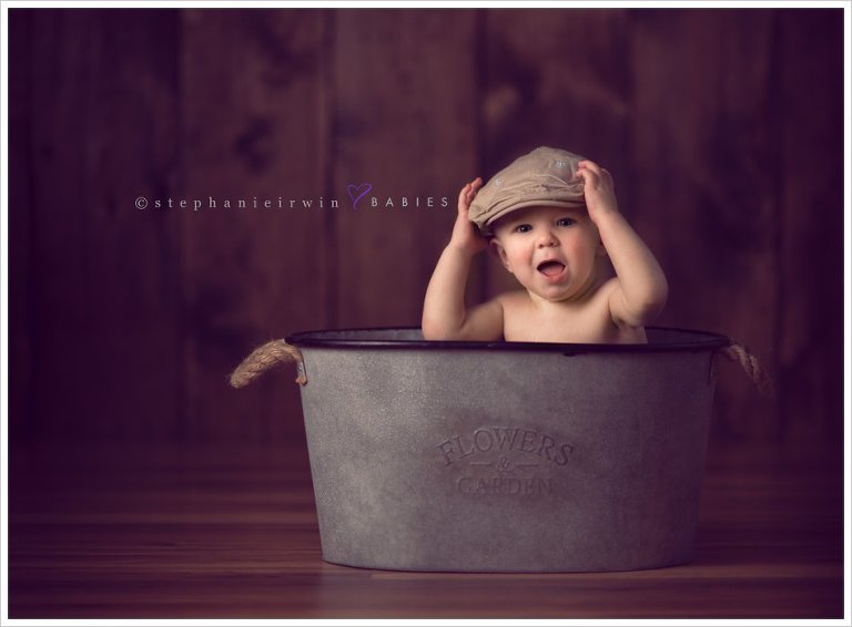 Baby photography Toronto session of 1 year old baby boy in bucket with hat