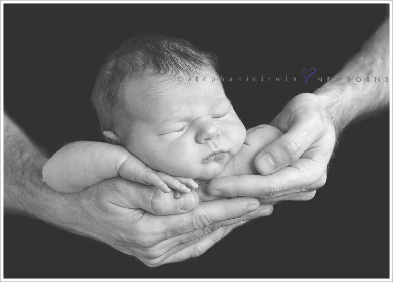 Baby in father's hands