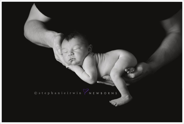 Markham newborn photography of baby boy in daddy's arms