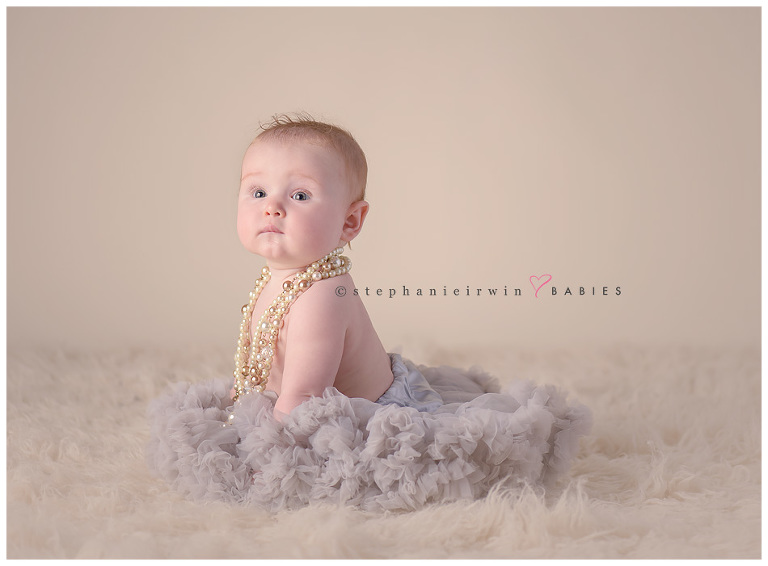 Toronto baby photography image of baby girl wearing pettiskirt and pearls